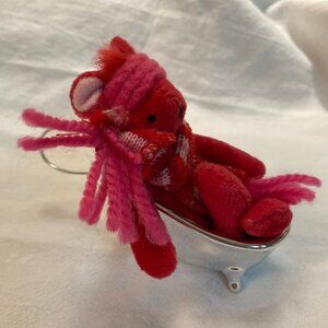 Small stuffed bear in bathtub holiday ornament